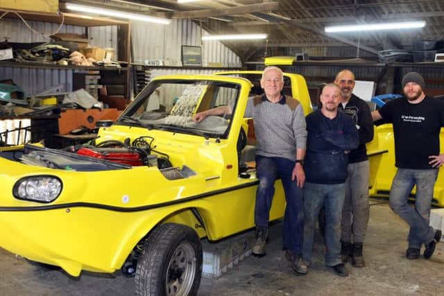 Tim Dutton, with his staff, Bryan Waller, Eddie Bain and Jack Gorski at Dutton Cars Ltd in Littlehampton. Photo by Derek Martin Photography
